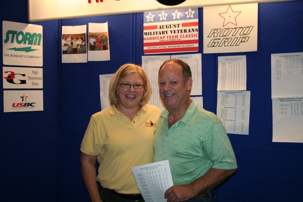 High Roller's Wendy Macpherson congratulates Don Kilgore, 1/2 of the winning doubles team.